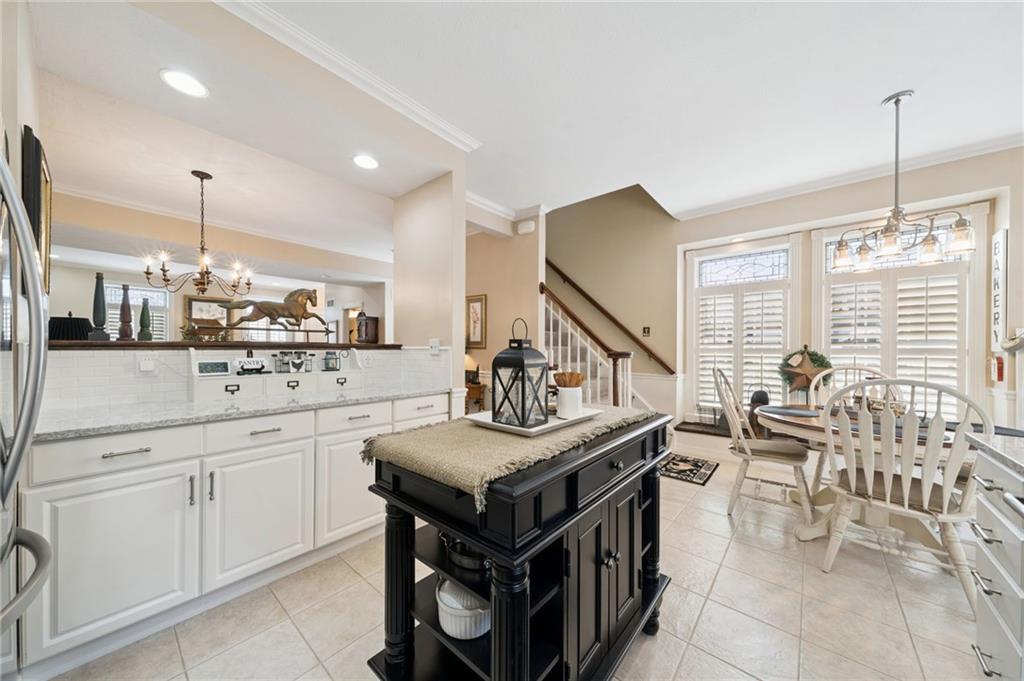 404 Beech Street Gibsonia, PA 15044 - Photo 10 of 32 a kitchen with stainless steel appliances kitchen island granite countertop a stove a sink and a refrigerator