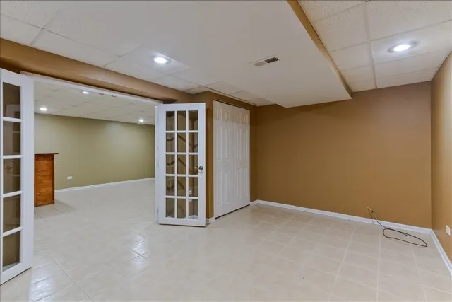 an empty room with furniture and entrance