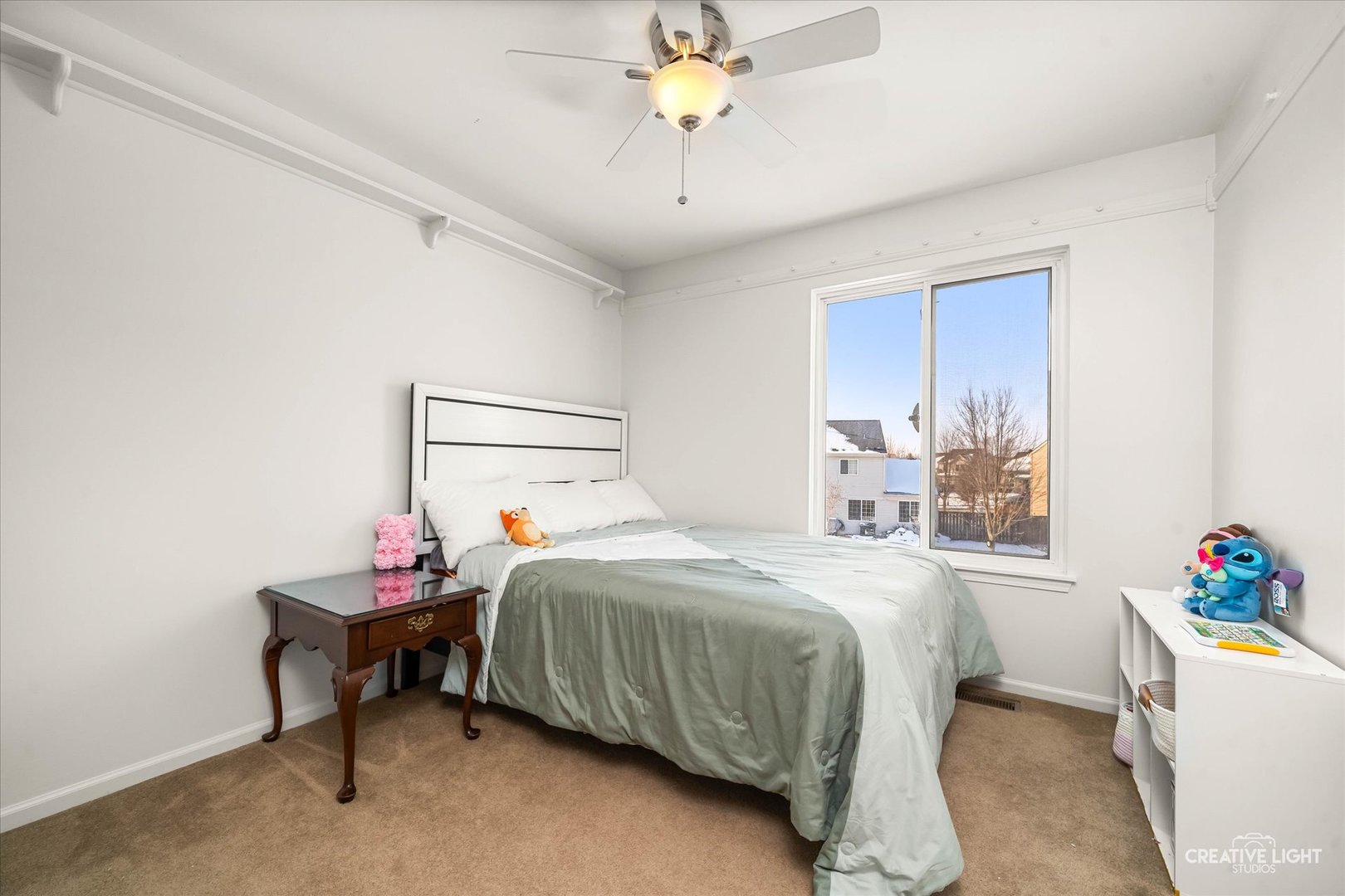 2455 Montclair Lane Montgomery, IL 60538 - Photo 14 of 22 a bedroom with a bed and a chandelier