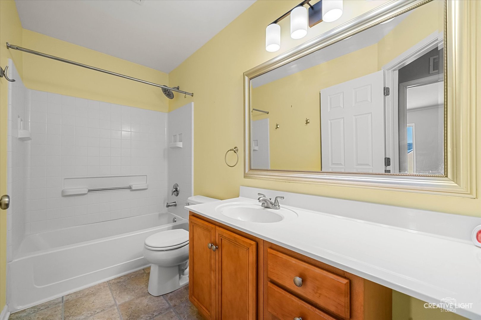 2455 Montclair Lane Montgomery, IL 60538 - Photo 16 of 22 a bathroom with a sink a toilet and shower