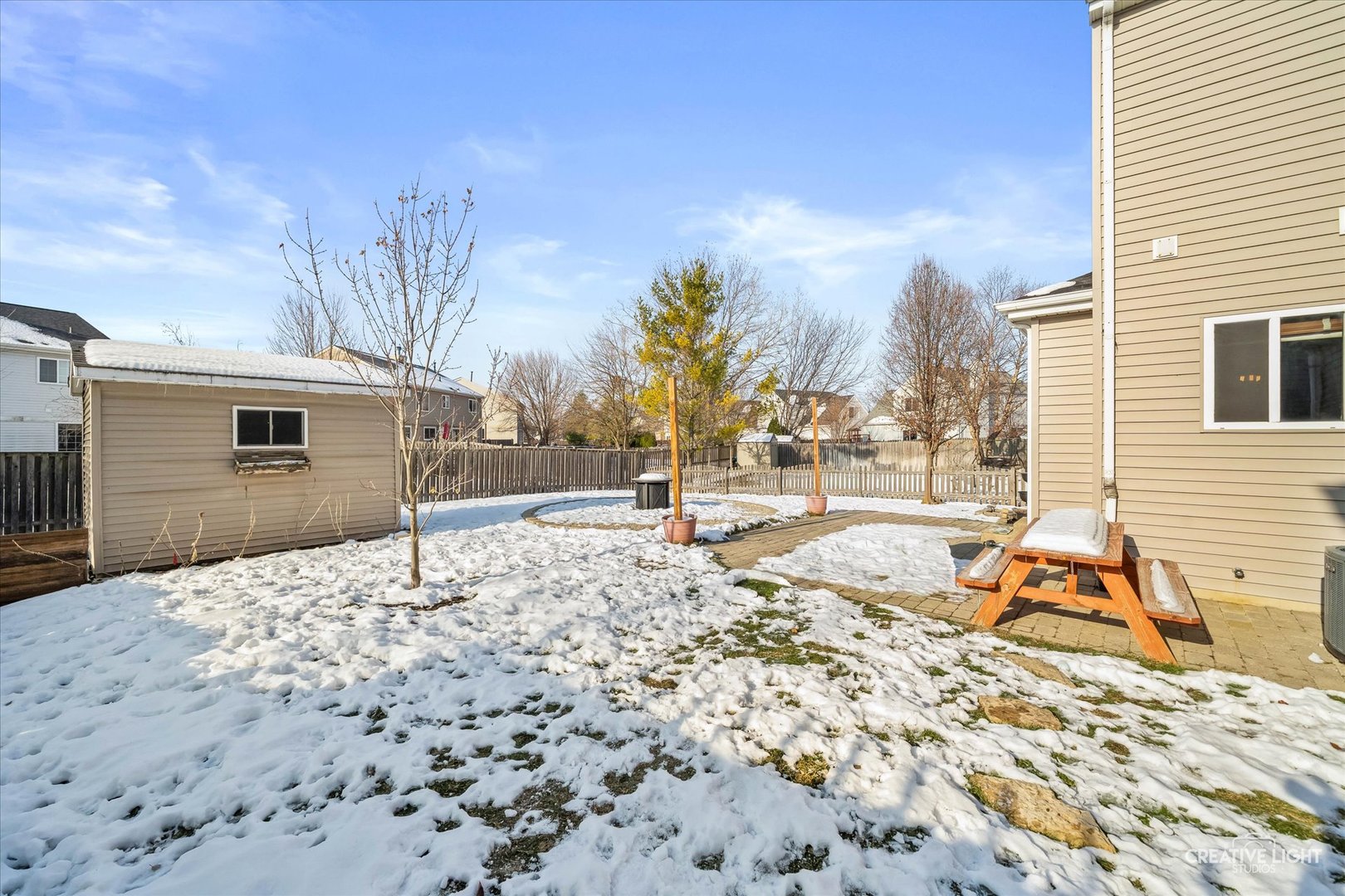 2455 Montclair Lane Montgomery, IL 60538 - Photo 20 of 22 a view of a backyard with snow on the road