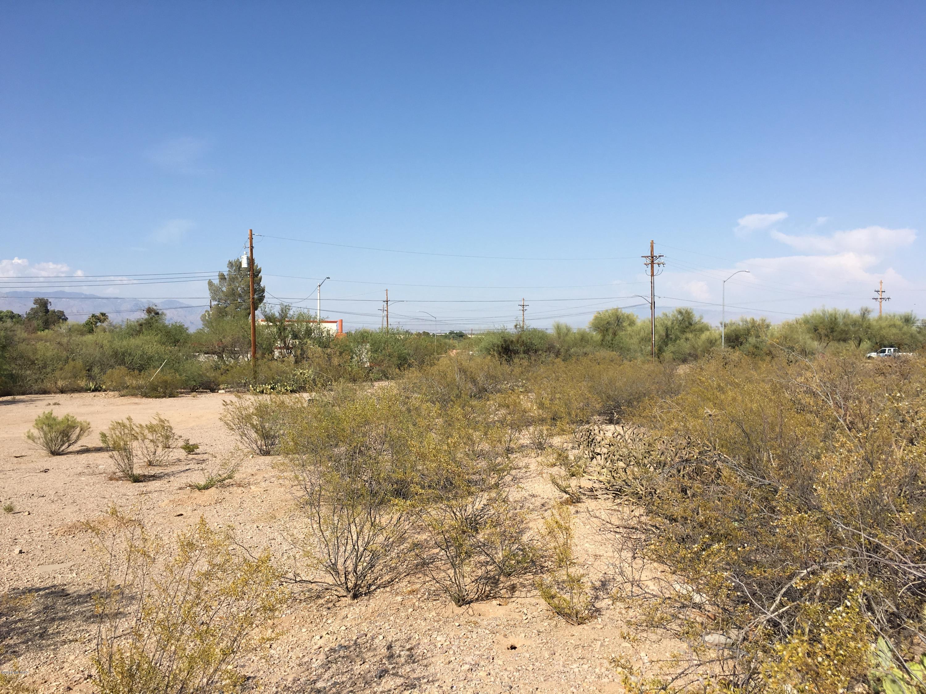 3002 South Mission Road Tucson, AZ 85713 - Photo 8 of 12 a view of a dry yard with wooden fence