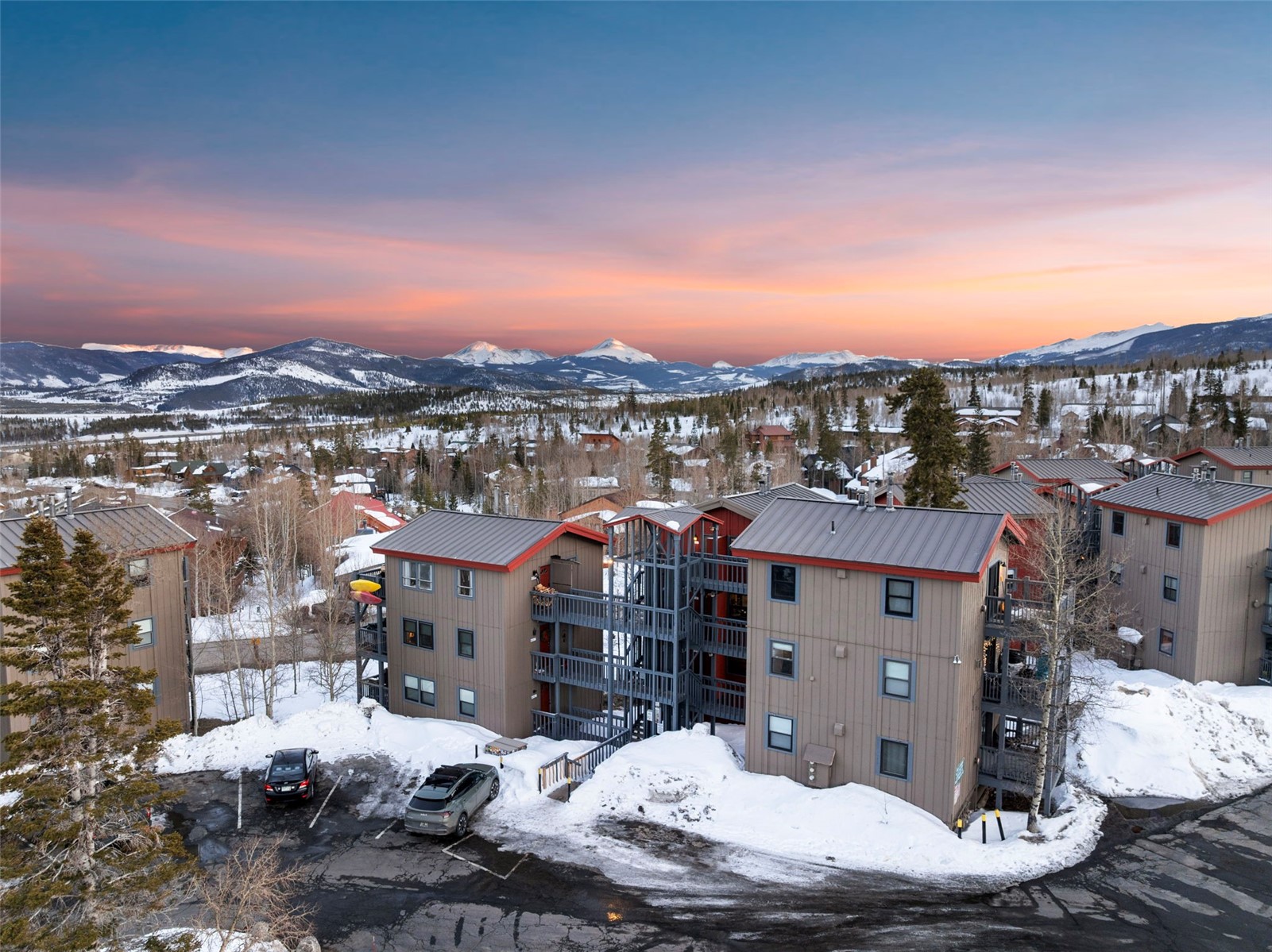 8015 Ryan Gulch Road, Unit B6 Silverthorne, CO 80498 - Photo 33 of 35 Snowy aerial view featuring a mountain view and a residential view