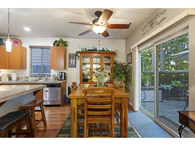 a view of a dining room with furniture wooden floor and chandelier