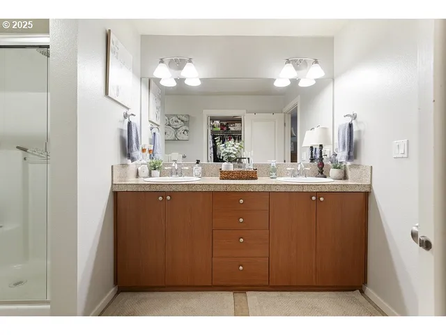 a bathroom with a sink vanity and a mirror