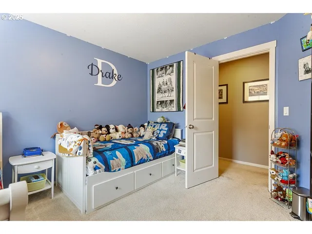 a bedroom with a bed and a couch