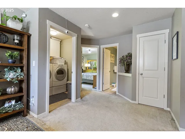 a view of livingroom with washer and dryer