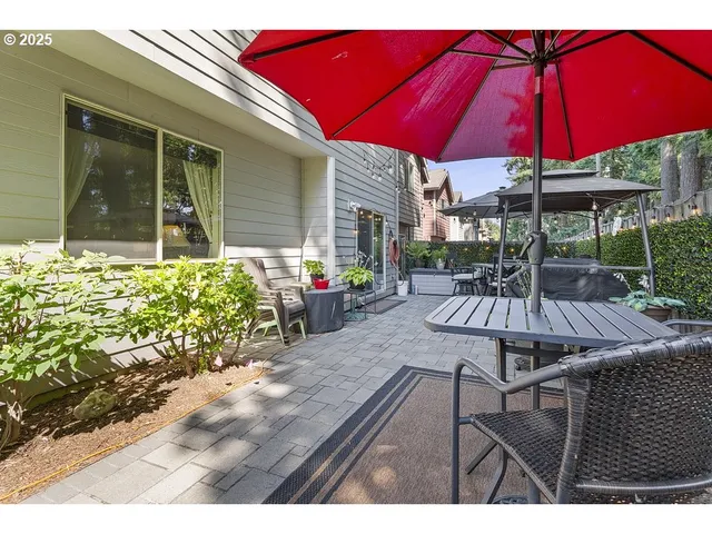 a view of a backyard with sitting area and furniture