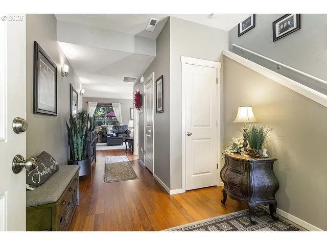 a living room with furniture and a chair