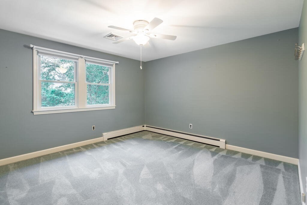 11 Augustus Road Lexington, MA 02421 - Photo 16 of 31 a view of an empty room with a window