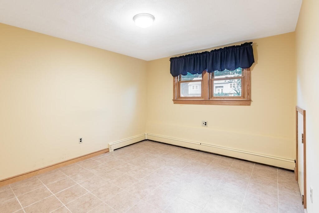 11 Augustus Road Lexington, MA 02421 - Photo 23 of 31 an empty room with a window