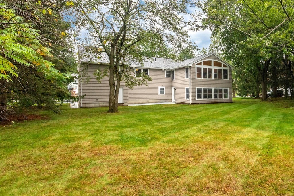 11 Augustus Road Lexington, MA 02421 - Photo 27 of 31 a view of a house with a yard