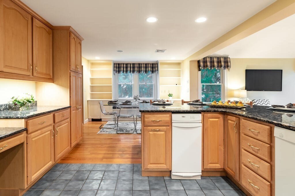 11 Augustus Road Lexington, MA 02421 - Photo 4 of 31 a open kitchen with granite countertop a sink and white cabinets