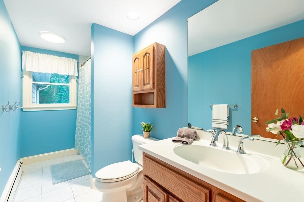 11 Augustus Road Lexington, MA 02421 - Photo 10 of 31 a bathroom with a sink and a mirror