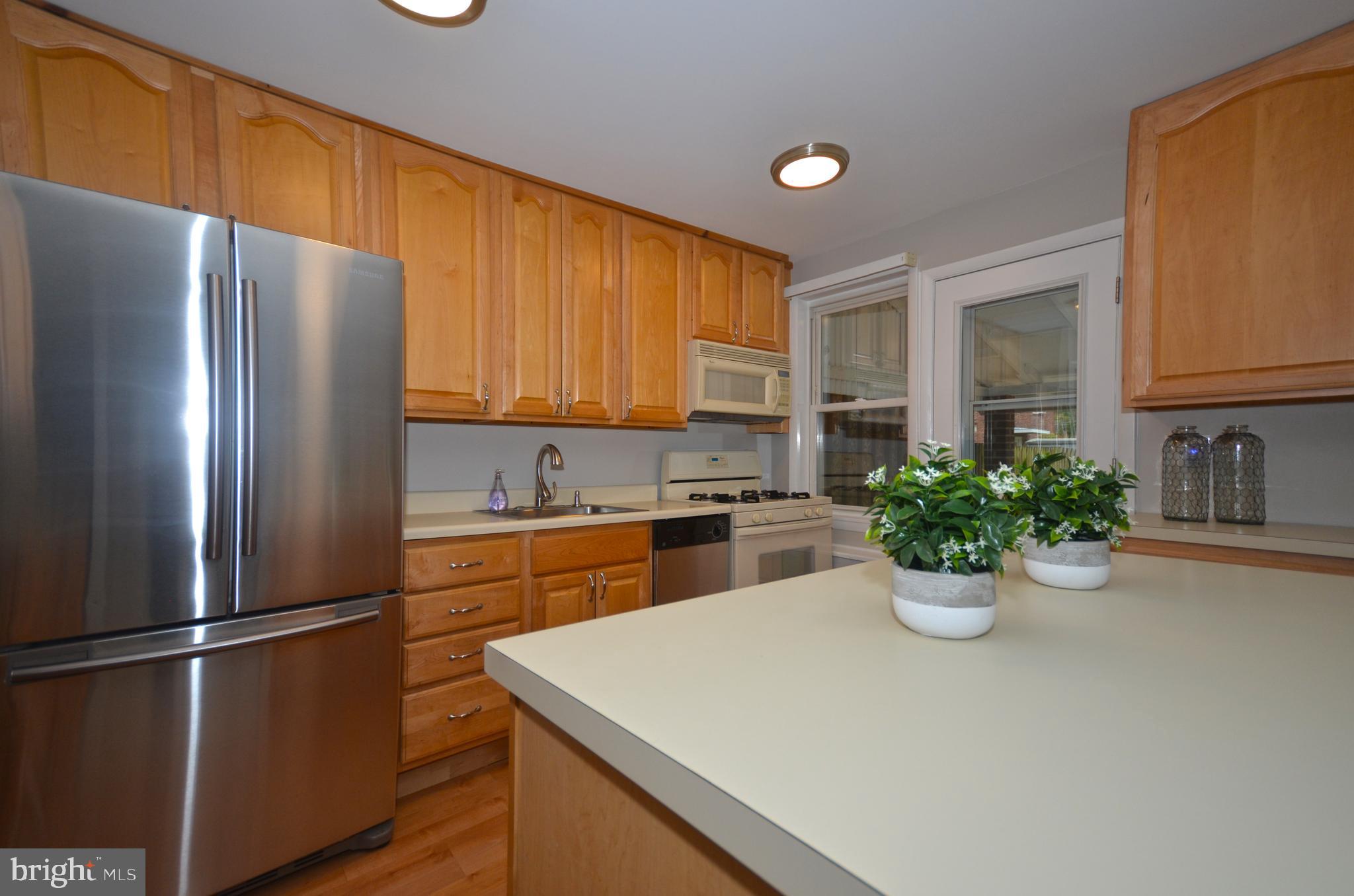 8508 Willow Oak Road Baltimore, MD 21234 - Photo 12 of 29 Stainless fridge, recessed lighting