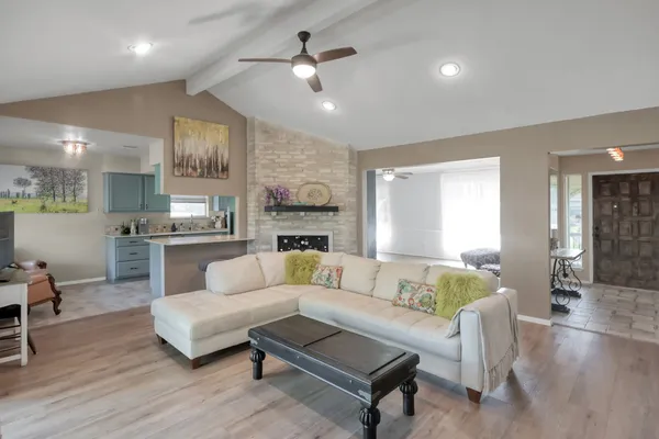 a living room with furniture and a large window