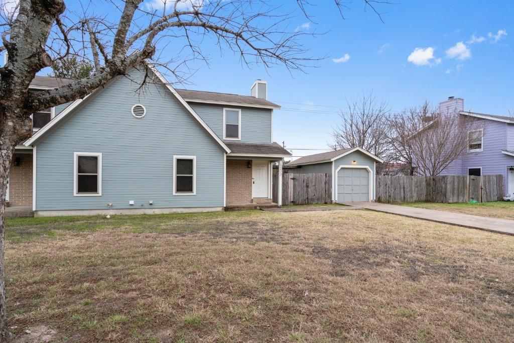 a house with lots of trees in the background