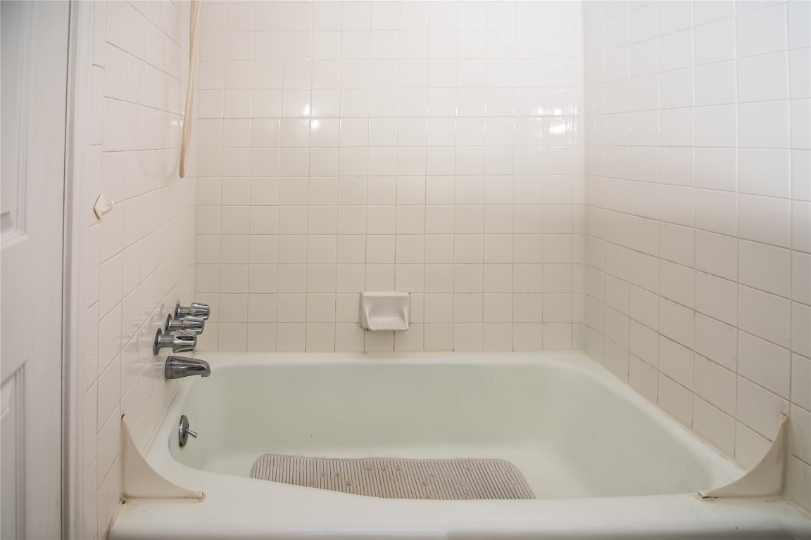8807 Springmail Circle, Unit A Austin, TX 78729 - Photo 18 of 27 a close up of a bathtub in a bathroom