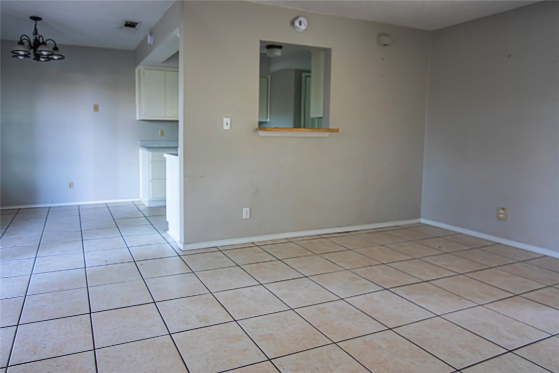 8807 Springmail Circle, Unit A Austin, TX 78729 - Photo 26 of 27 a view of an empty room and window