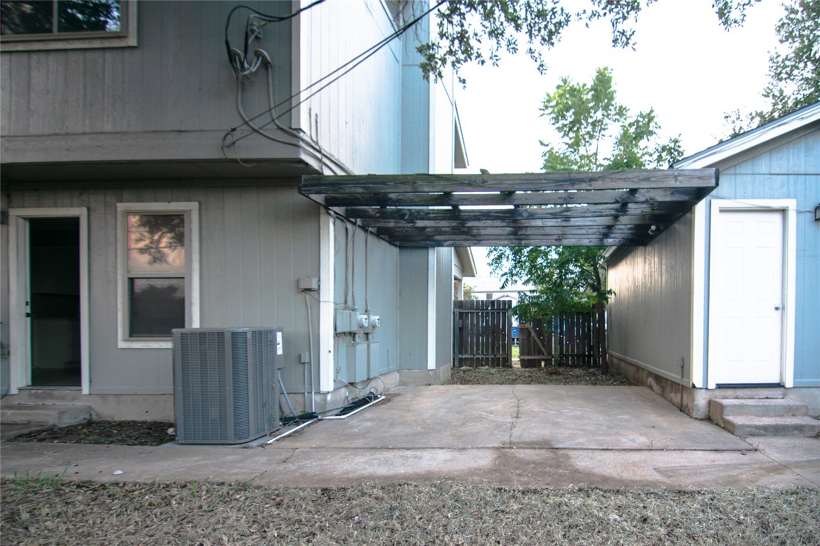 8807 Springmail Circle, Unit A Austin, TX 78729 - Photo 10 of 27 a view of a house with a wooden fence