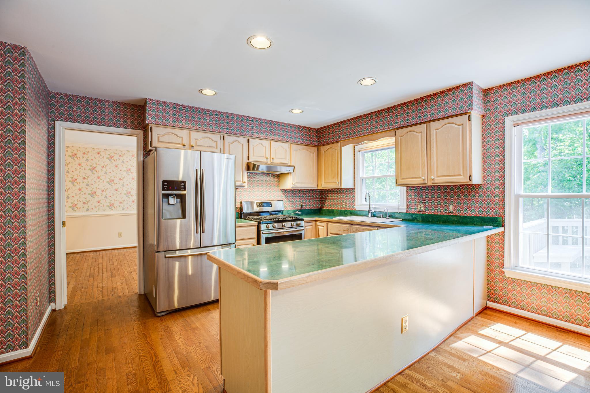 Large island in kitchen with newer appliances