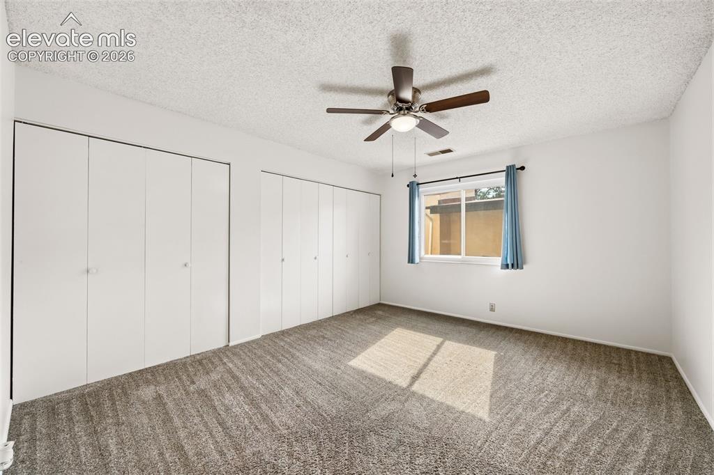 1018 Fontmore Road, Unit A Colorado Springs, CO 80904 - Photo 16 of 28 a view of an empty room with a window