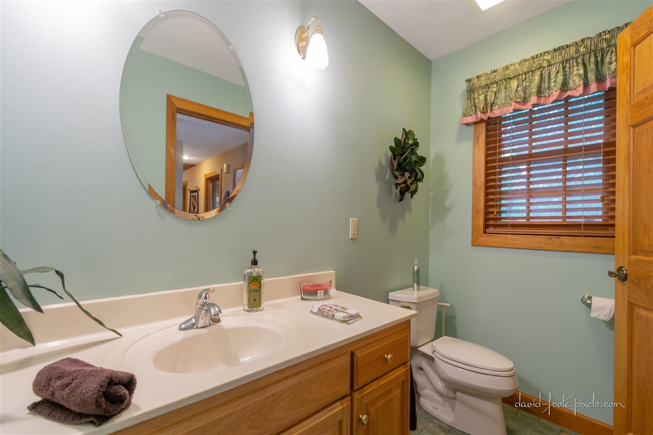 8620 Fisher Road Hanover, IL 61041 - Photo 23 of 49 a bathroom with a toilet sink and mirror