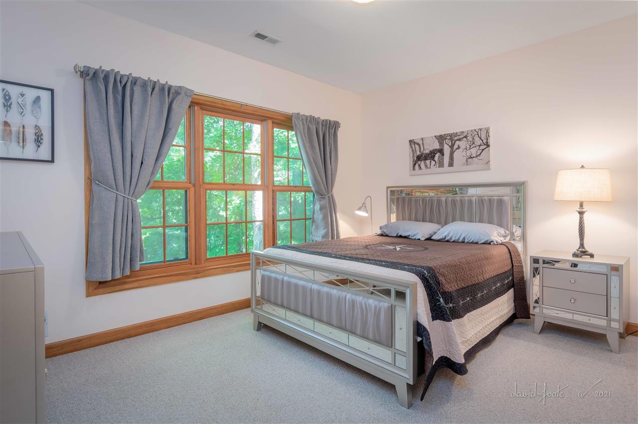8620 Fisher Road Hanover, IL 61041 - Photo 49 of 49 a bed sitting in a bedroom next to a window