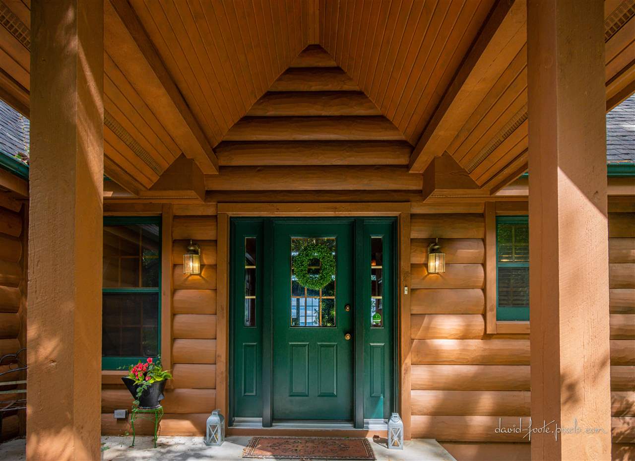 8620 Fisher Road Hanover, IL 61041 - Photo 6 of 49 a front view of a house with a glass door