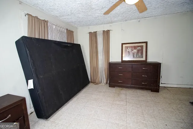 a view of room with furniture and closet
