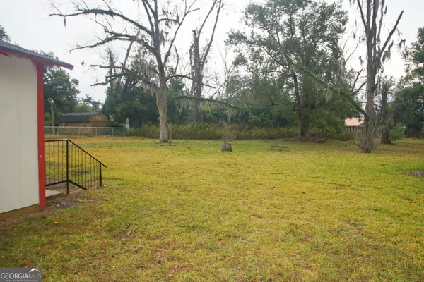 a view of a swimming pool with an outdoor space and seating area