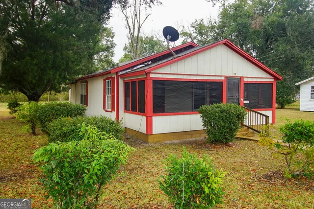 a view of front of house with a yard