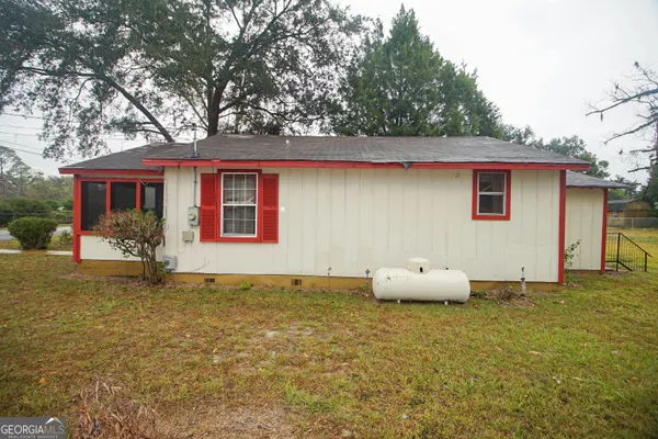 a house with trees in front of it
