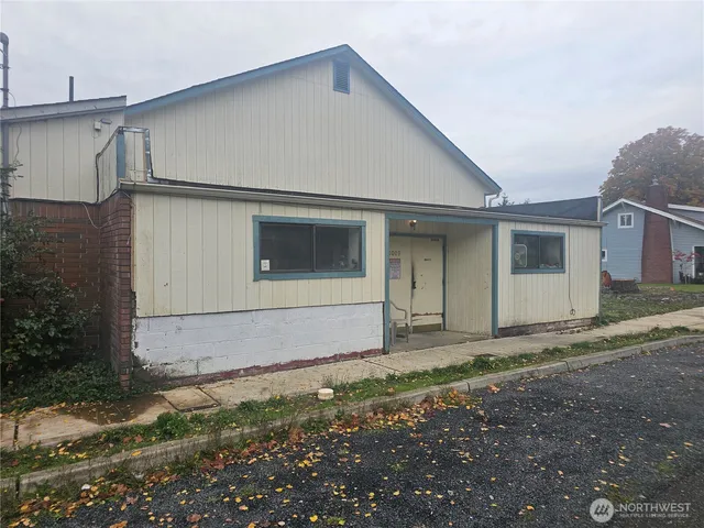 a house with trees in the background