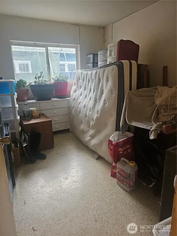 a living room with furniture rug and window
