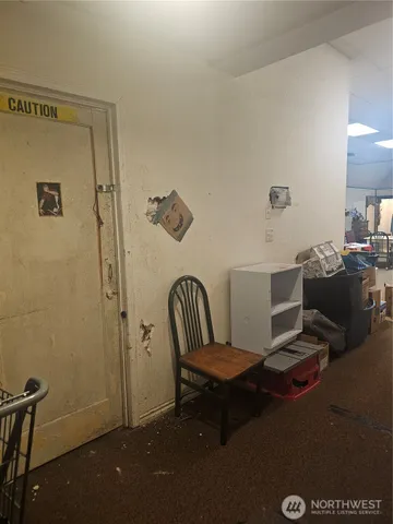 a view of a hallway with seating area