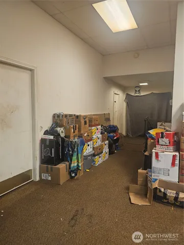 a view of a garage with a bike and car
