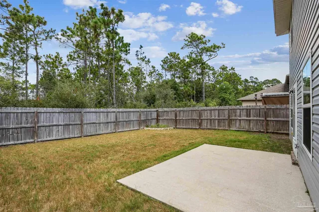 a view of a backyard with a small yard