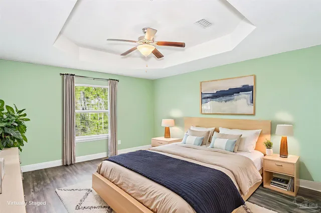 a bedroom with a large bed and a window