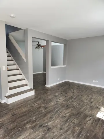 a bathroom with a sink mirror and toilet
