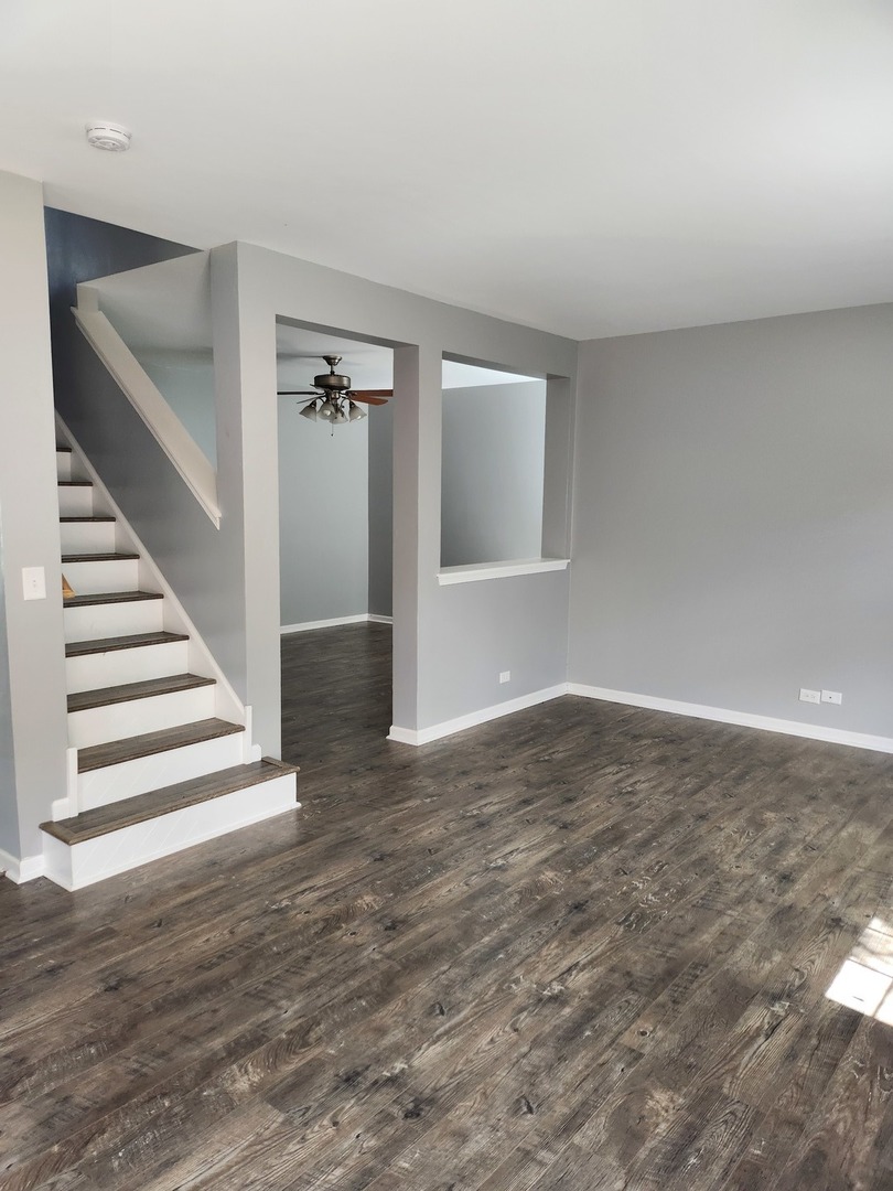 316 East Victoria Circle, Unit 316 North Aurora, IL 60542 - Photo 13 of 54 a view of entryway and hall with wooden floor