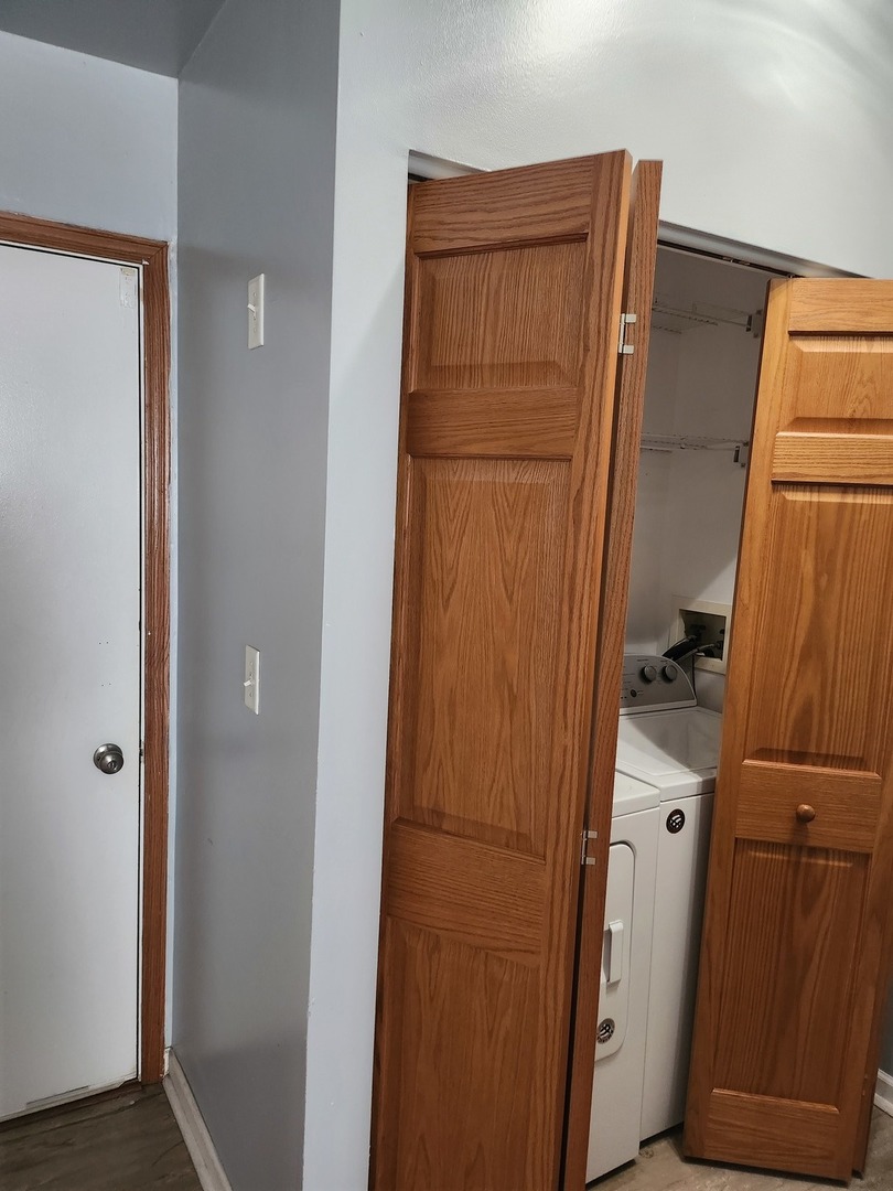 316 East Victoria Circle, Unit 316 North Aurora, IL 60542 - Photo 33 of 54 a bathroom with a shower and a door