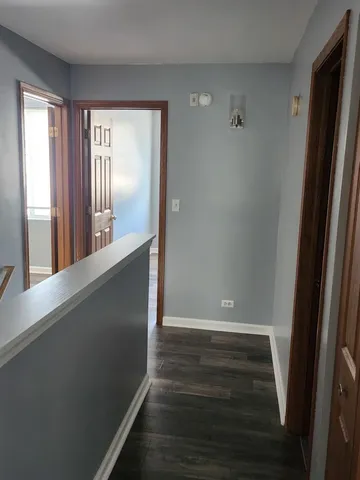 a view of a room with window and wooden floor