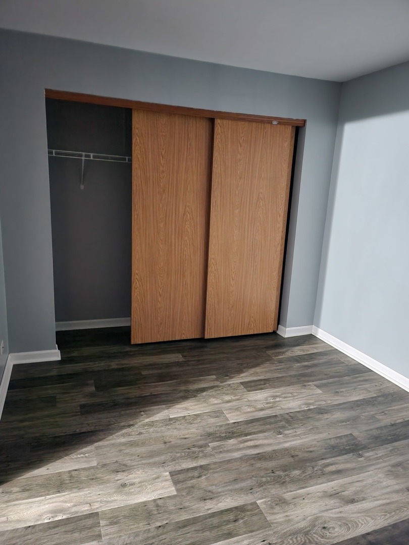 316 East Victoria Circle, Unit 316 North Aurora, IL 60542 - Photo 43 of 54 a view of a room with wooden floor