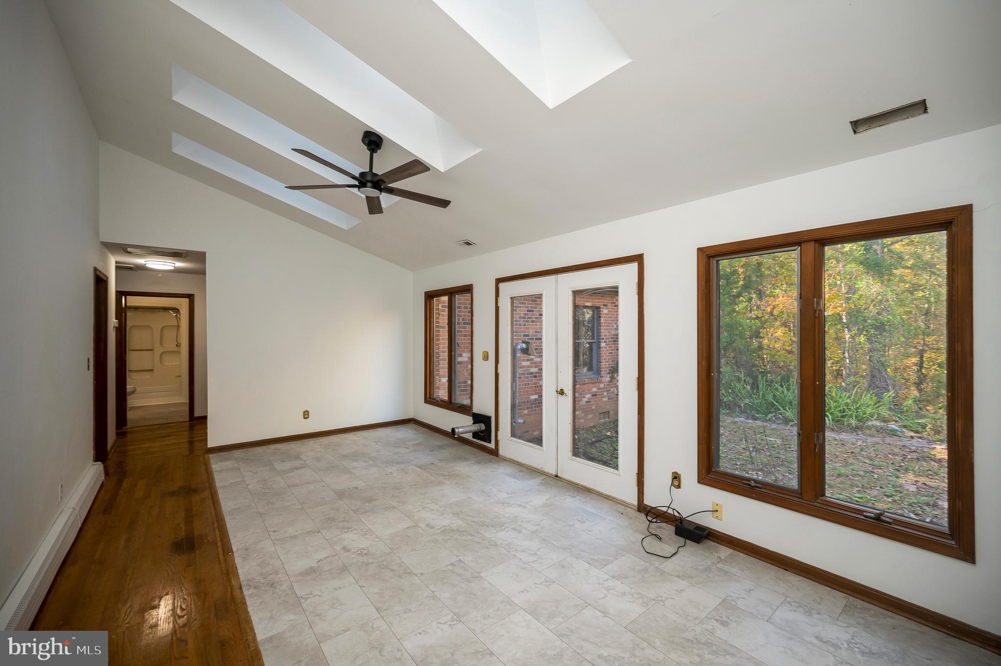 6709 Marye Road Spotsylvania, VA 22551 - Photo 21 of 73 wooden floor in an empty room with a window