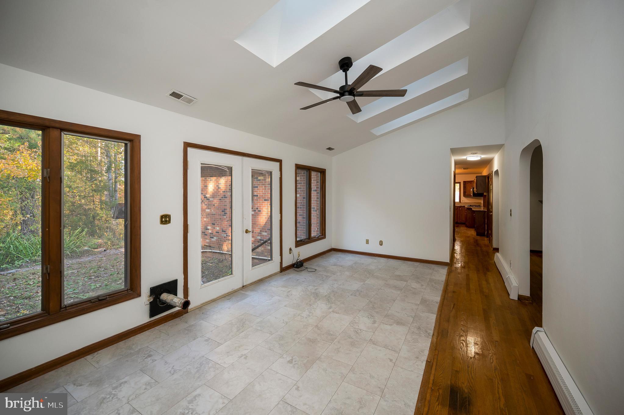 6709 Marye Road Spotsylvania, VA 22551 - Photo 23 of 73 a view of an empty room with window and a livingroom