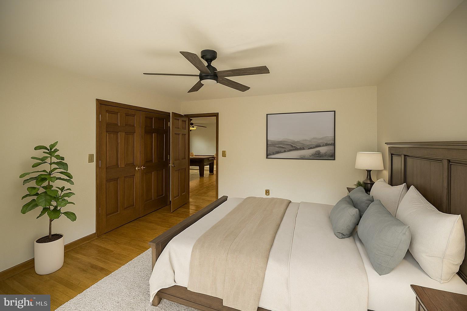 6709 Marye Road Spotsylvania, VA 22551 - Photo 26 of 73 a bedroom with a bed and a potted plant