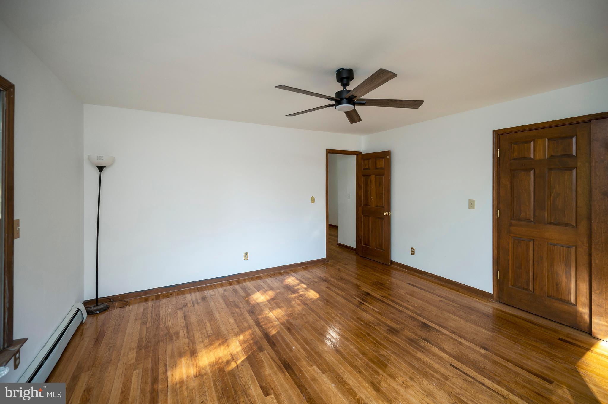 6709 Marye Road Spotsylvania, VA 22551 - Photo 29 of 73 a view of empty room with wooden floor and fan