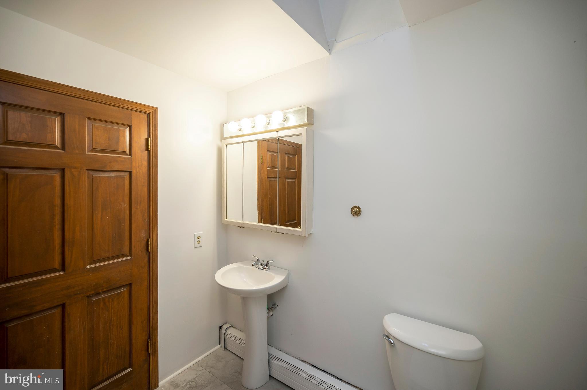6709 Marye Road Spotsylvania, VA 22551 - Photo 31 of 73 a bathroom with a toilet sink