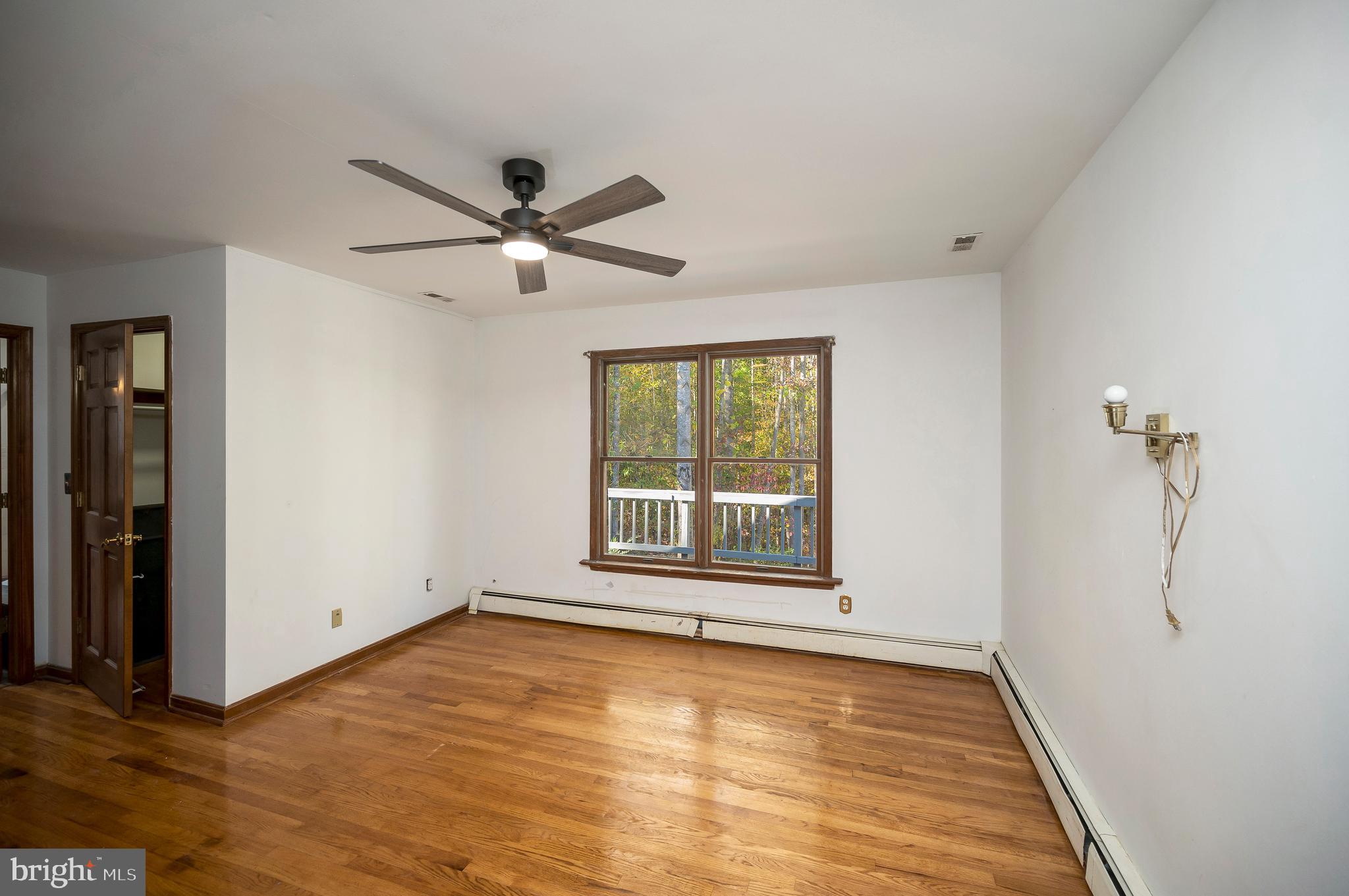 6709 Marye Road Spotsylvania, VA 22551 - Photo 51 of 73 wooden floor in an empty room with a window